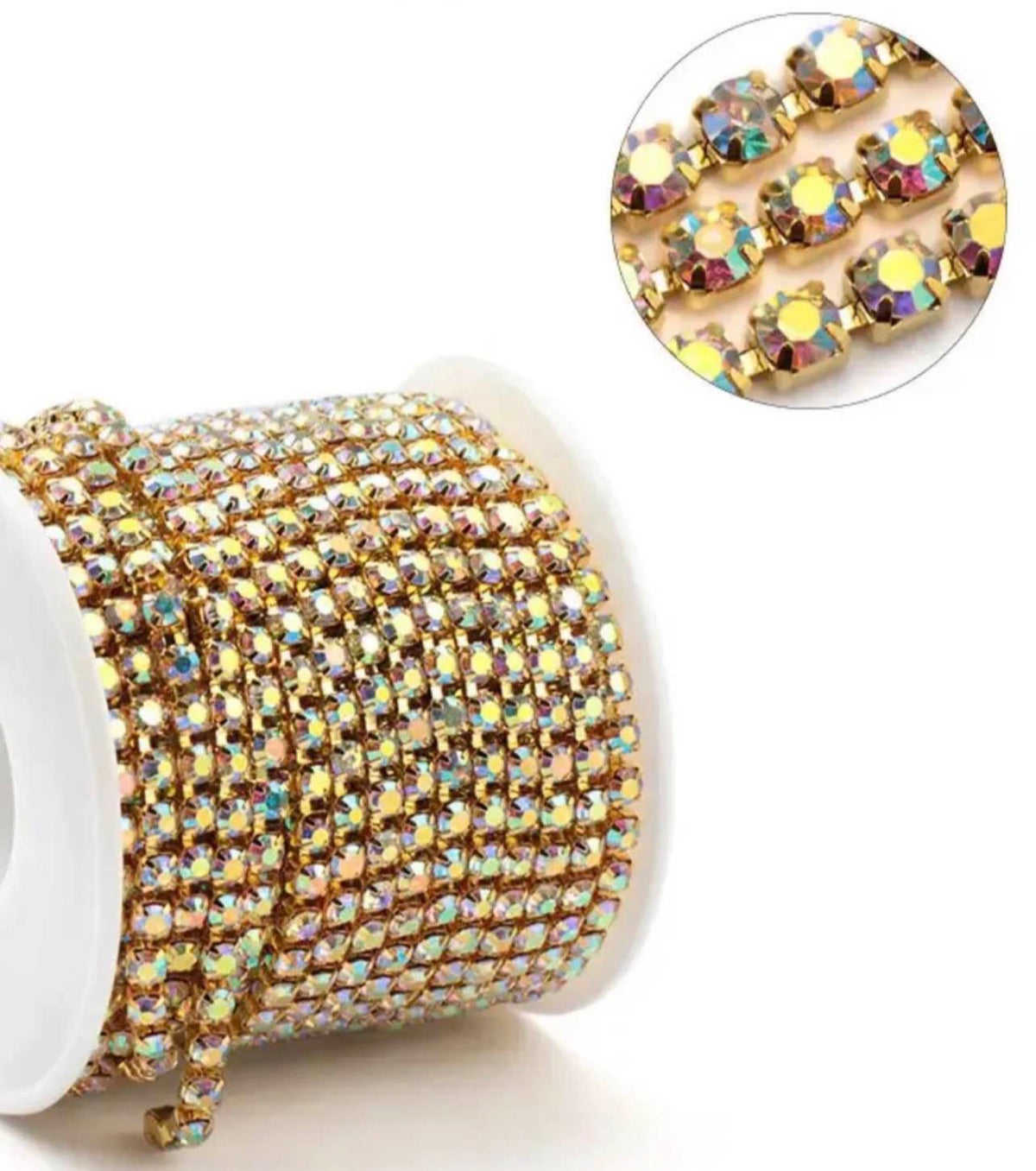 A spool of gold rhinestone trim with iridescent, multicolor reflective stones, shown on a white background with a circular inset close-up of the stone pattern.