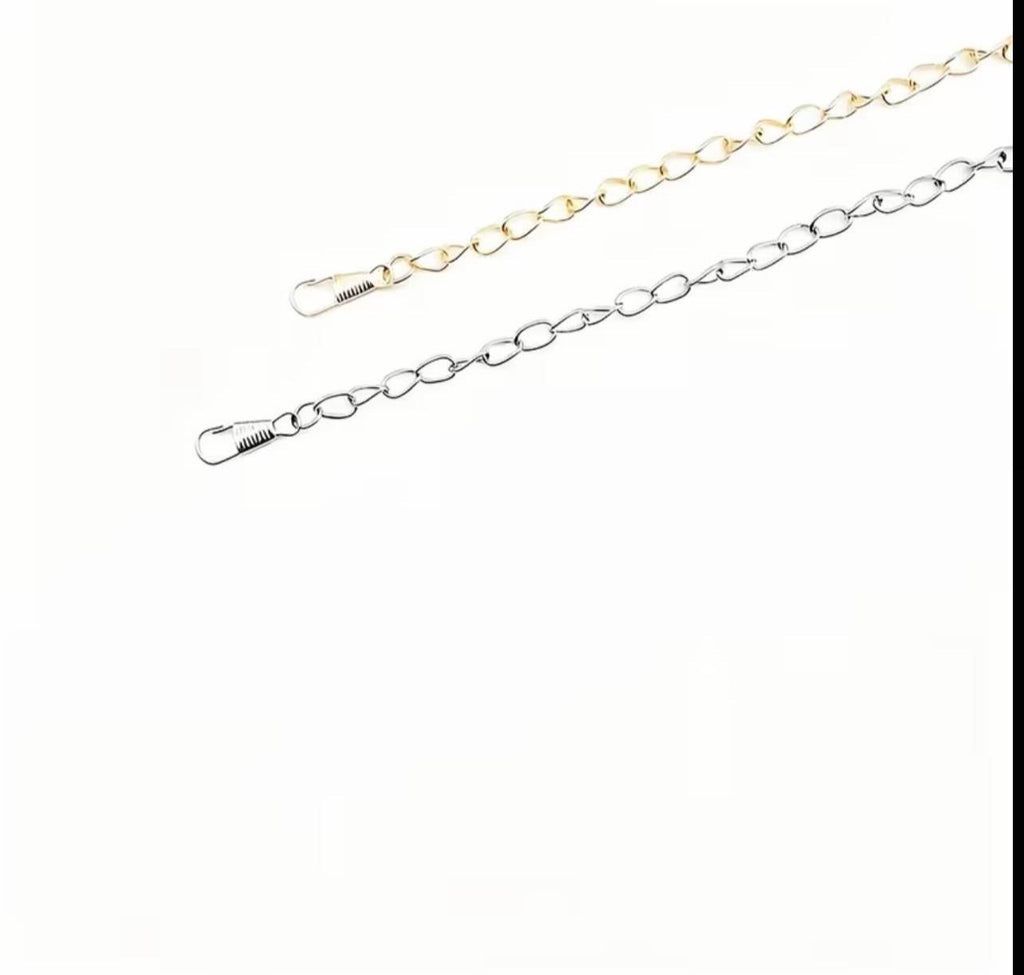 Two metal chain extensions with spring clips, one in gold-tone and one in silver-tone, shown on a plain white background.