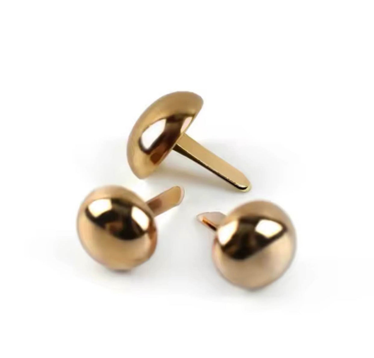 Three gold-toned mushroom stud earrings shown on a clean white background, with two front-facing and one side-facing view.