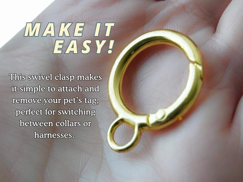 A shiny gold metal swivel clasp ring shown resting on a person's palm, with overlaid text explaining its use for attaching and removing pet tags or collars.
