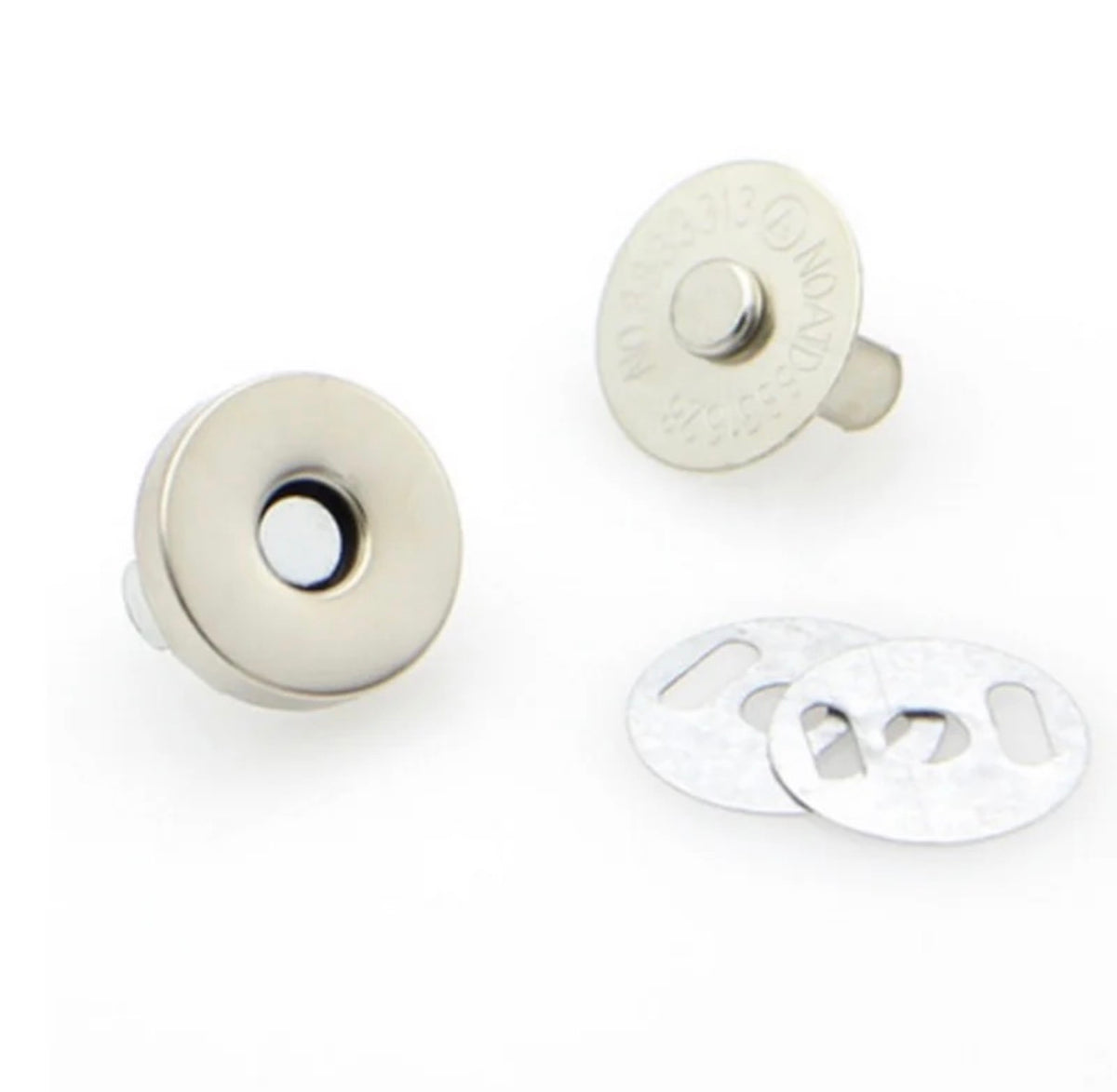 Two silver-toned metal snap buttons with flat backing discs, shown on a plain white background.