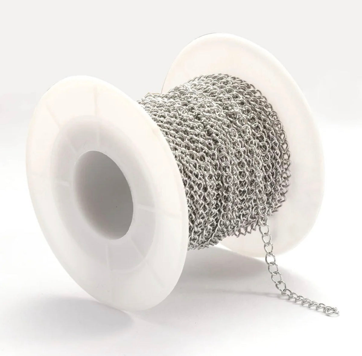 A spool of silver-colored metal chain with a white plastic core, shown on a clean white background.
